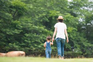 Elizabeth and daughter walking on farm
