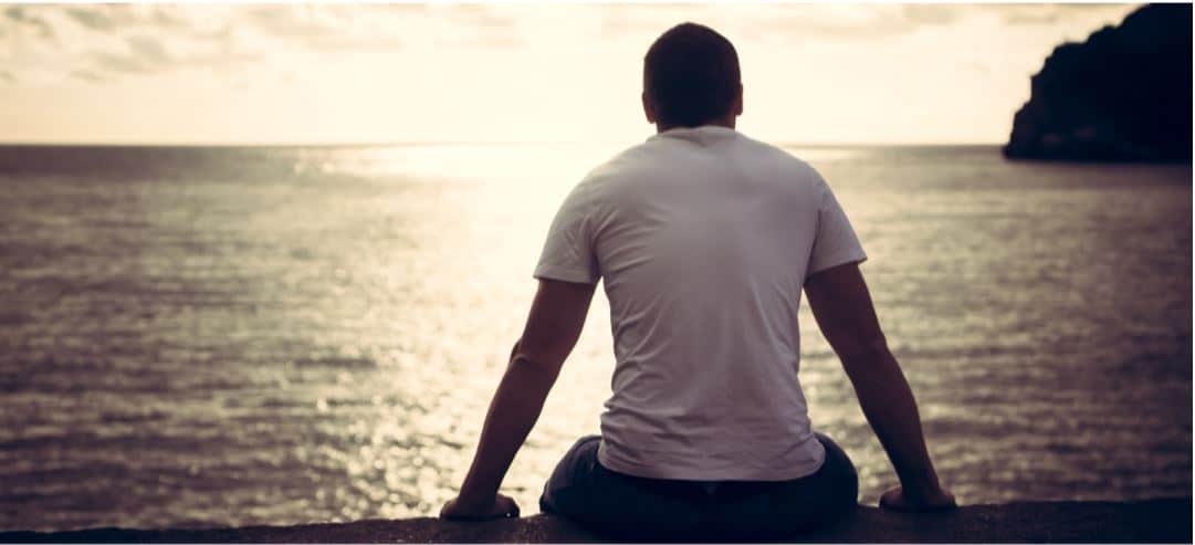 Cover photo of a man looking out on the water for article about Florida Justice Institute case forces change in prison health care policy