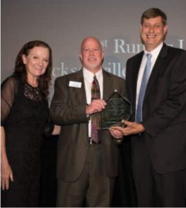 JALA's Pro Bono Director Kathy Para and Executive Director Jim Kowalski accept the first runner-up Goldstein Award from Joe Lang.
