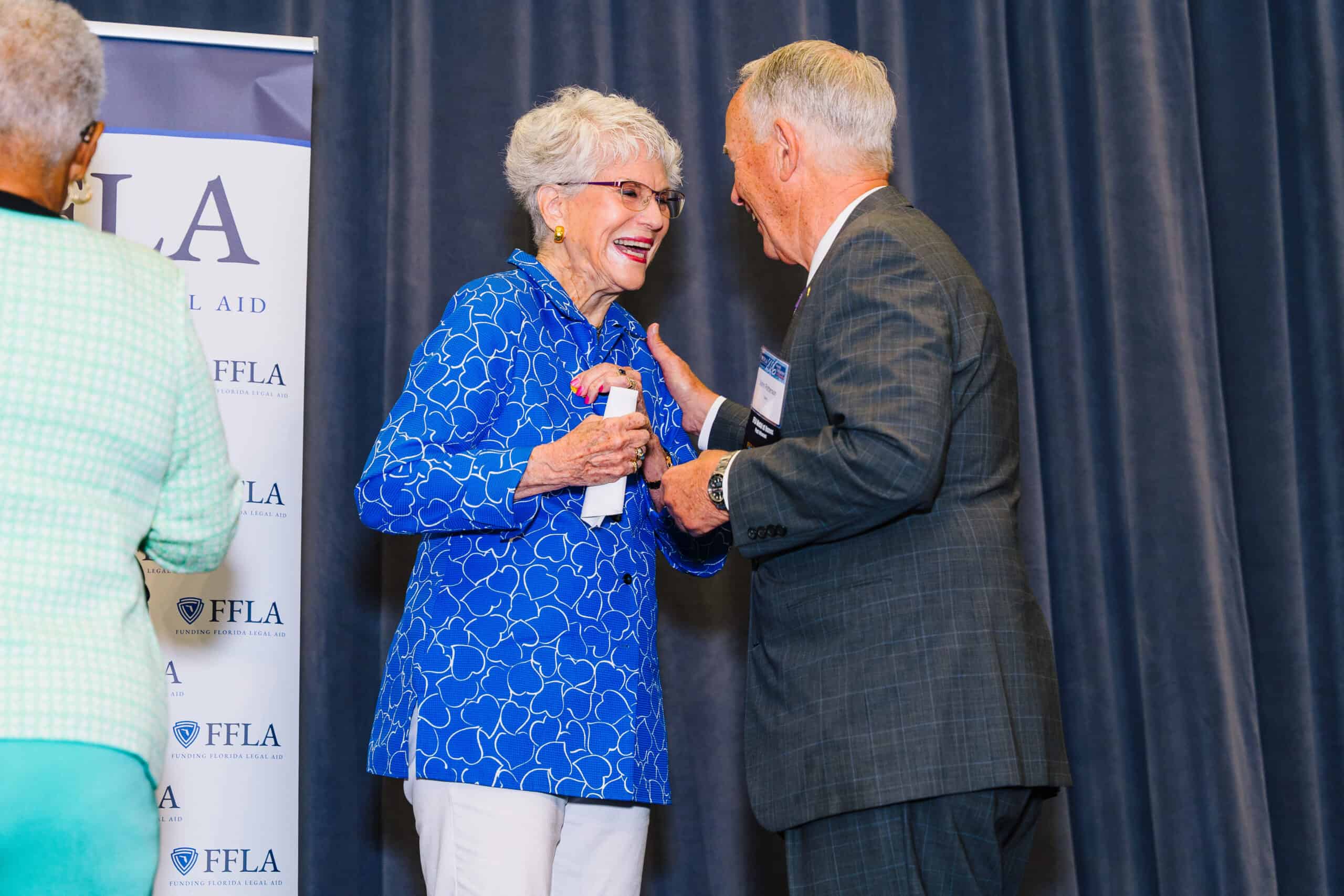 John Patterson pins Dr. Sarah H. Pappas